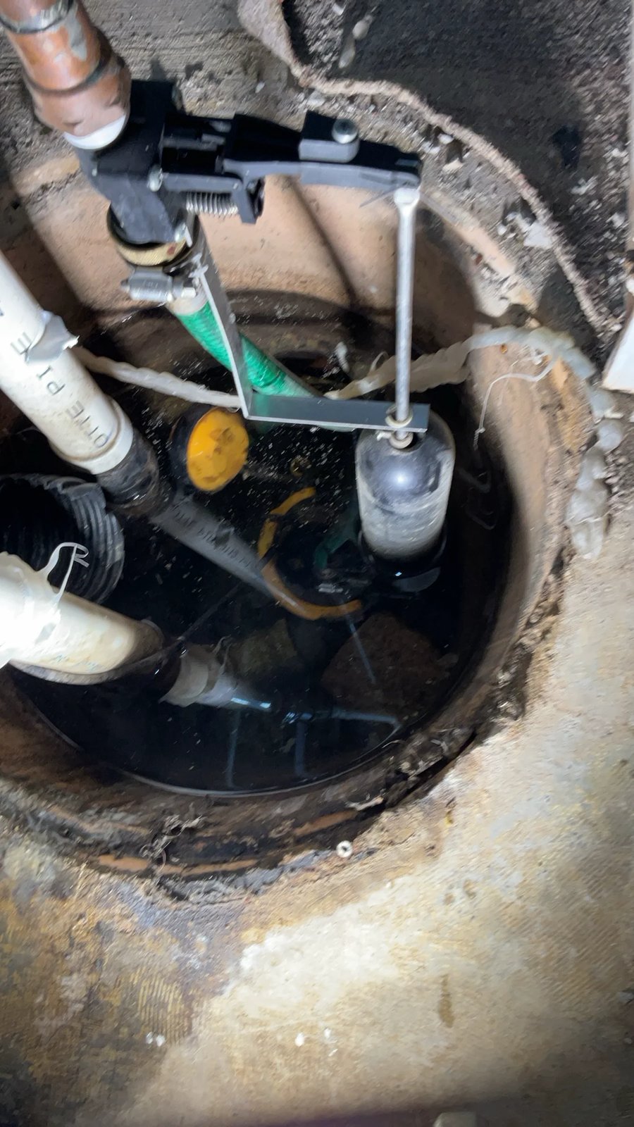 Sump pump with check valve in a basement pit