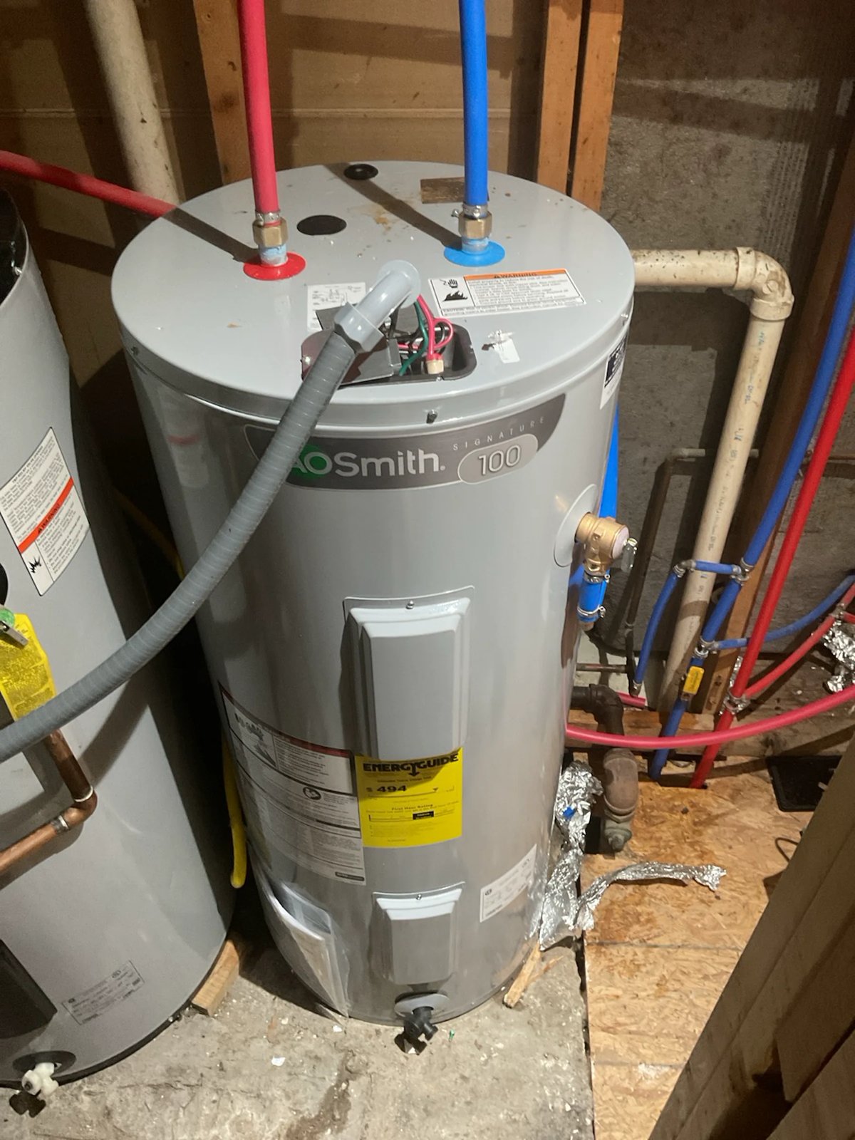New A. O. Smith electric water heater with new water lines
